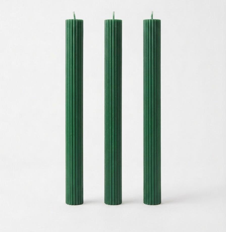 Green Linear Elegance candles with straight sides and vertical ribs.
