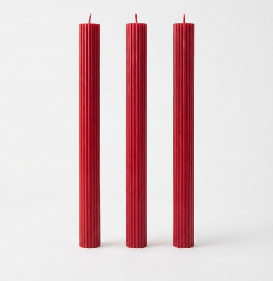 Red Linear Elegance candles with straight sides and vertical ribs.