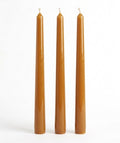 Caramel-colored Classic Elegance taper candles with smooth sides on a white background.