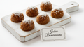 Brown Jalao wax melts with a textured surface and white flakes, arranged on a pale wooden board.