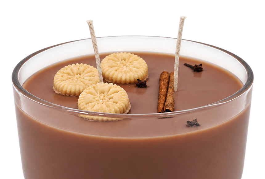 Close-up of the brown Habichuelas con Dulce candle, showing wicks and biscuit-shaped decorations.